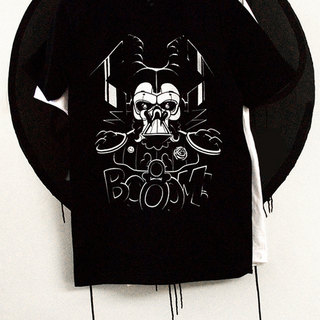 Illustration for article titled Can You Find The 13 Heroes Hidden On This Shirt?